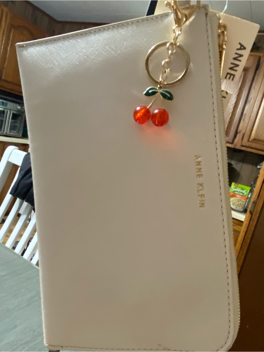 Anne Klein Cream Wristlet with Cherry Charm
